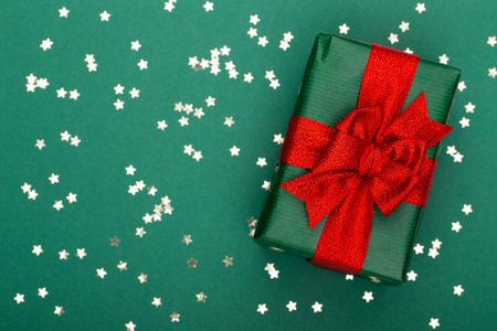 Glittering christmas background. Star dust and golden glitter. Holidays background for web and...