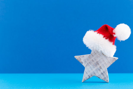 Christmas star, decor on pastel colored background. Christmas or New Year minimal concept.の写真素材
