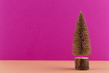 Christmas tree on pastel colored background. Christmas or New Year minimal concept.の写真素材