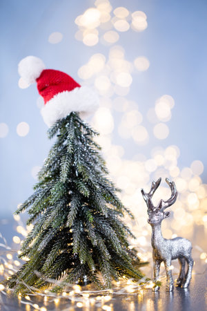 Christmas tree on blue bokeh background.の写真素材
