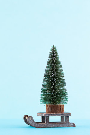 Christmas tree on pastel colored background. Christmas or New Year minimal concept.の写真素材