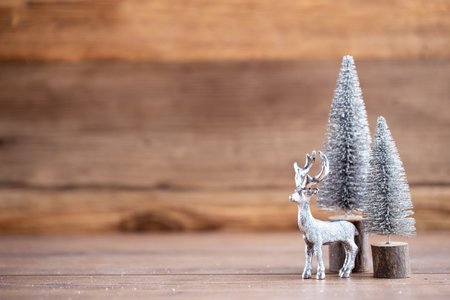Colorful Christmas tree on wooden, bokeh background. Christmas holiday celebration concept. Greeting card.の写真素材