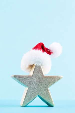 Christmas star, decor on pastel colored background. Christmas or New Year minimal concept.の写真素材