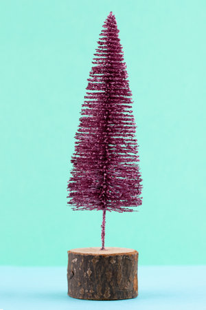 Christmas tree on pastel colored background. Christmas or New Year minimal concept.の写真素材