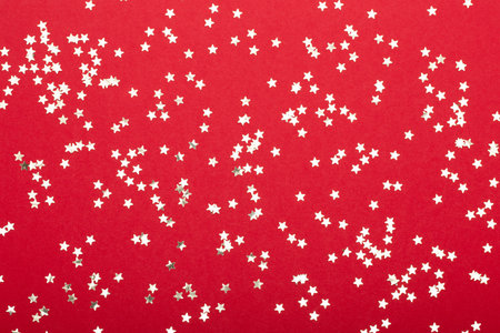 Glittering christmas background. Star dust and golden glitter. Holidays background for web and print.の写真素材