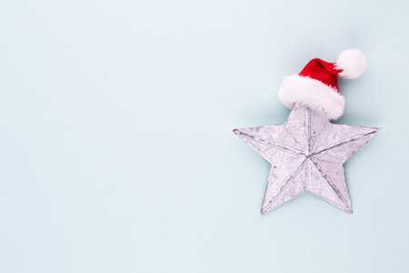 Christmas star, decor on pastel colored background. Christmas or New Year minimal concept.の写真素材