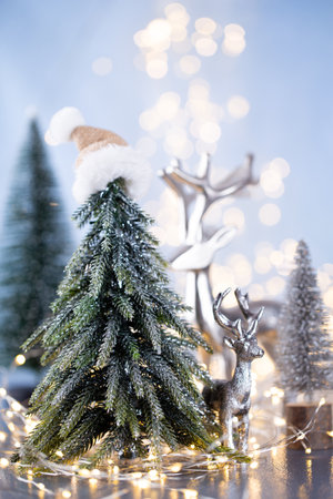 Christmas tree on blue bokeh background.の写真素材