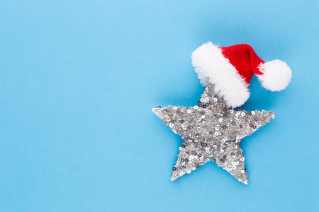 Christmas star, decor on pastel colored background. Christmas or New Year minimal concept.の写真素材
