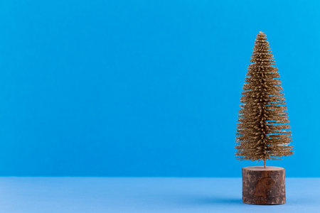 Christmas tree on pastel colored background. Christmas or New Year minimal concept.の写真素材