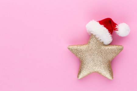 Christmas star, decor on pastel colored background. Christmas or New Year minimal concept.の写真素材