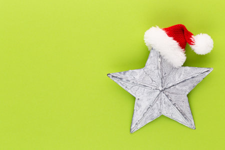 Christmas star, decor on pastel colored background. Christmas or New Year minimal concept.の写真素材