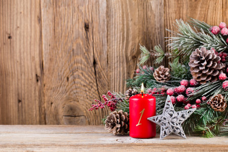 Christmas greeting card. Festive decoration on wooden background. New Year concept. Copy space.  Flat lay. Top view.の写真素材