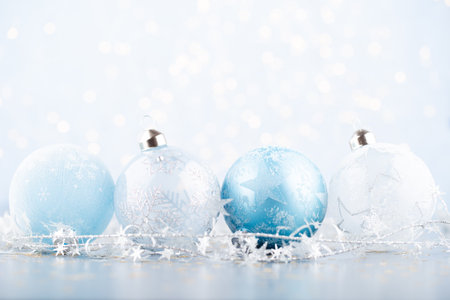 Christmas ball background. Greeting card decorations on a blue bokeh background.の写真素材