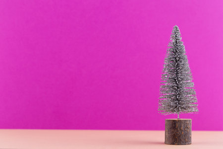 Christmas tree on pastel colored background. Christmas or New Year minimal concept.の写真素材