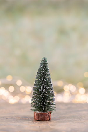 Colorful Christmas tree on green, bokeh background.の写真素材