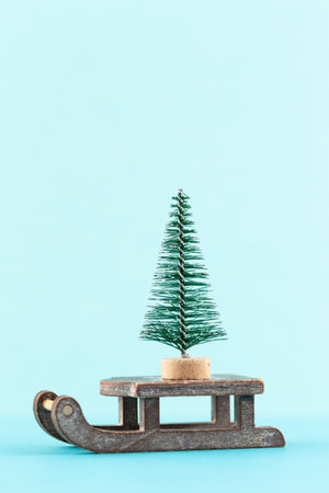 Christmas tree on pastel colored background. Christmas or New Year minimal concept.の写真素材