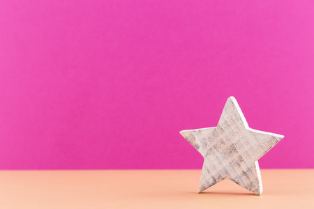 Christmas star, decor on pastel colored background. Christmas or New Year minimal concept.の写真素材