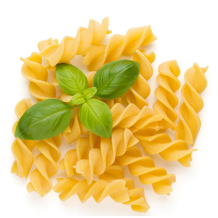 Raw uncooked pasta penne on the white background.の写真素材