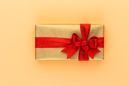 Christmas gift boxes with ribbons on color tabletop.の写真素材