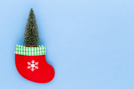 Christmas tree on pastel colored background. Christmas or New Year minimal concept.の写真素材