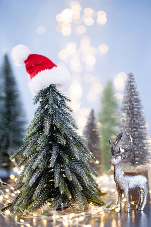 Christmas tree on blue bokeh background.の写真素材