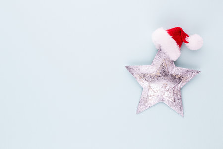 Christmas star, decor on pastel colored background. Christmas or New Year minimal concept.の写真素材