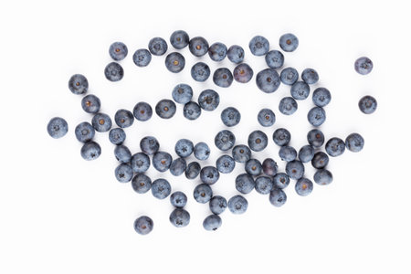 Blueberries isolated on white background. Blueberry border design. Ripe and juicy fresh picked bilberries close up.の写真素材