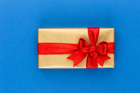 Christmas gift boxes with ribbons on color tabletop.の写真素材