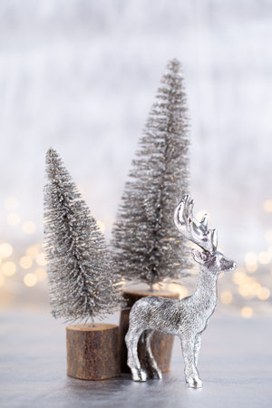 Christmas tree on silver, bokeh background.の写真素材