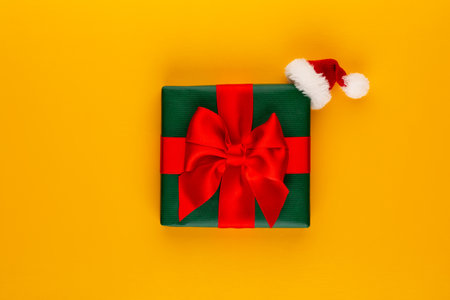 Gift or present box on color table top view. Flat lay composition for birthday, mother day or wedding.の写真素材