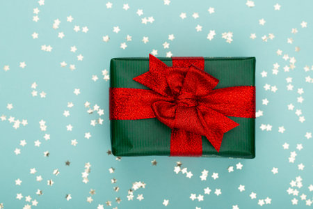 Glittering christmas background. Star dust and golden glitter. Holidays background for web and print.の写真素材