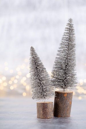 Christmas tree on silver, bokeh background.の写真素材