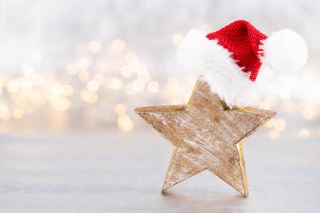 Christmas star, decor on bokeh silver background. Christmas or New Year minimal concept.の写真素材
