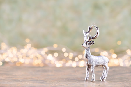Christmas reindeer on bokeh silver background. Christmas or New Year minimal concept.の写真素材