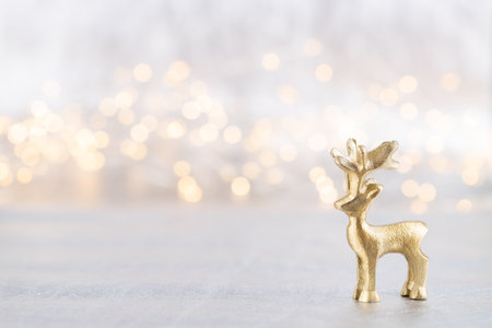 Christmas reindeer on bokeh silver background. Christmas or New Year minimal concept.の写真素材