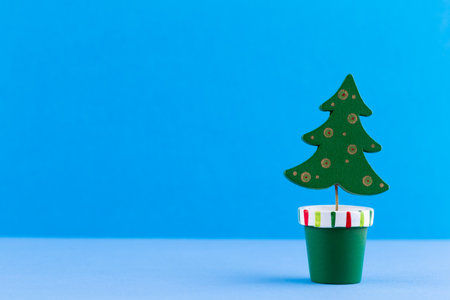 Christmas tree on pastel colored background. Christmas or New Year minimal concept.の写真素材