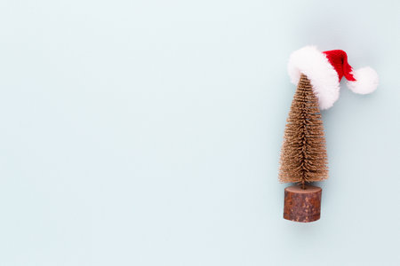 Christmas tree on pastel colored background. Christmas or New Year minimal concept.の写真素材