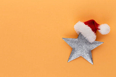 Christmas star, decor on pastel colored background. Christmas or New Year minimal concept.の写真素材