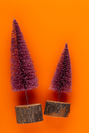 Christmas decoration, fir tree on orange background.の写真素材
