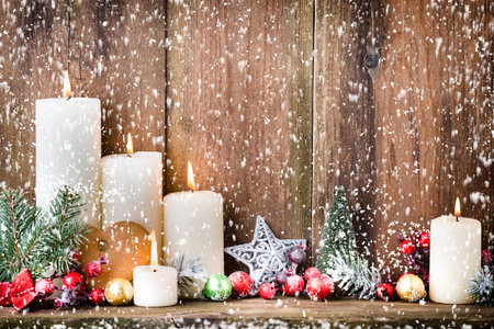Christmas Advent candles with festive decor.の写真素材