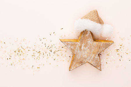 Festive pastel background. Christmas stars and shining glitter, confetti on pastel background. Christmas. Wedding. Birthday. Valentine's Day. Flat lay.の写真素材