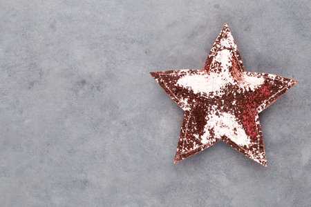 Christmas star, decor on pastel colored background. Christmas or New Year minimal concept.の写真素材