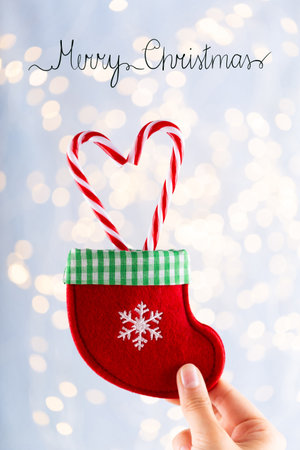 Vintage Christmas background with Christmas candy stick decoration. Christmas greeting card. Festive decoration on bokex silver background. New Year concept. Copy space. Flat lay. Top view.の写真素材