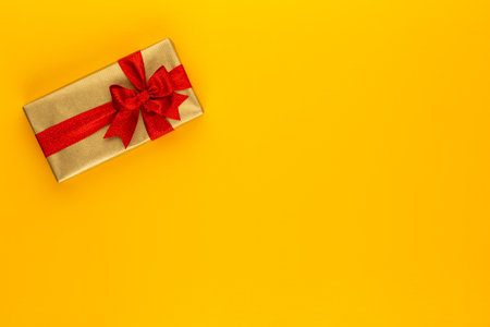 Gift or present box on color table top view. Flat lay composition for birthday, mother day or wedding.の写真素材