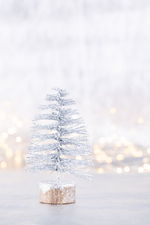 Christmas tree on silver, bokeh background.の写真素材