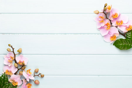 Spa aromatherapy background, flat lay of various beauty care products decorated with simple orchid flowers.の写真素材