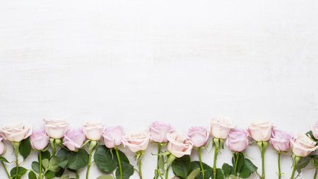 Flowers valentine day greeting card. Frame made of pink rose on gray background. Flat lay, top view, copy space.の写真素材