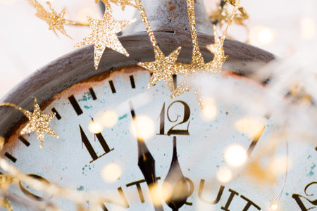 Abstract background with fireworks and clock close to midnight. Christmas and happy new years eve background.の写真素材