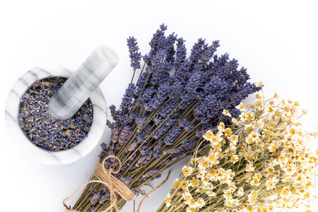 Natural cosmetics with lavender and orange, lemon  for homemade spa on white background top view mock up.の写真素材