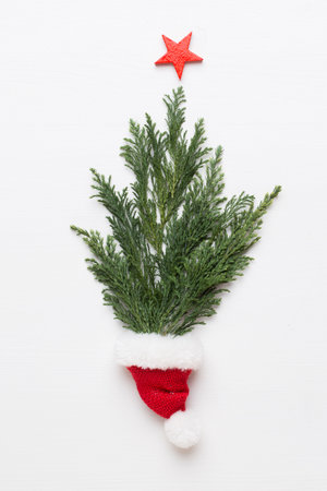 Christmas greeting card. Decoration on white wooden background. New Year concept. Copy space.  Flat lay. Top view.の写真素材